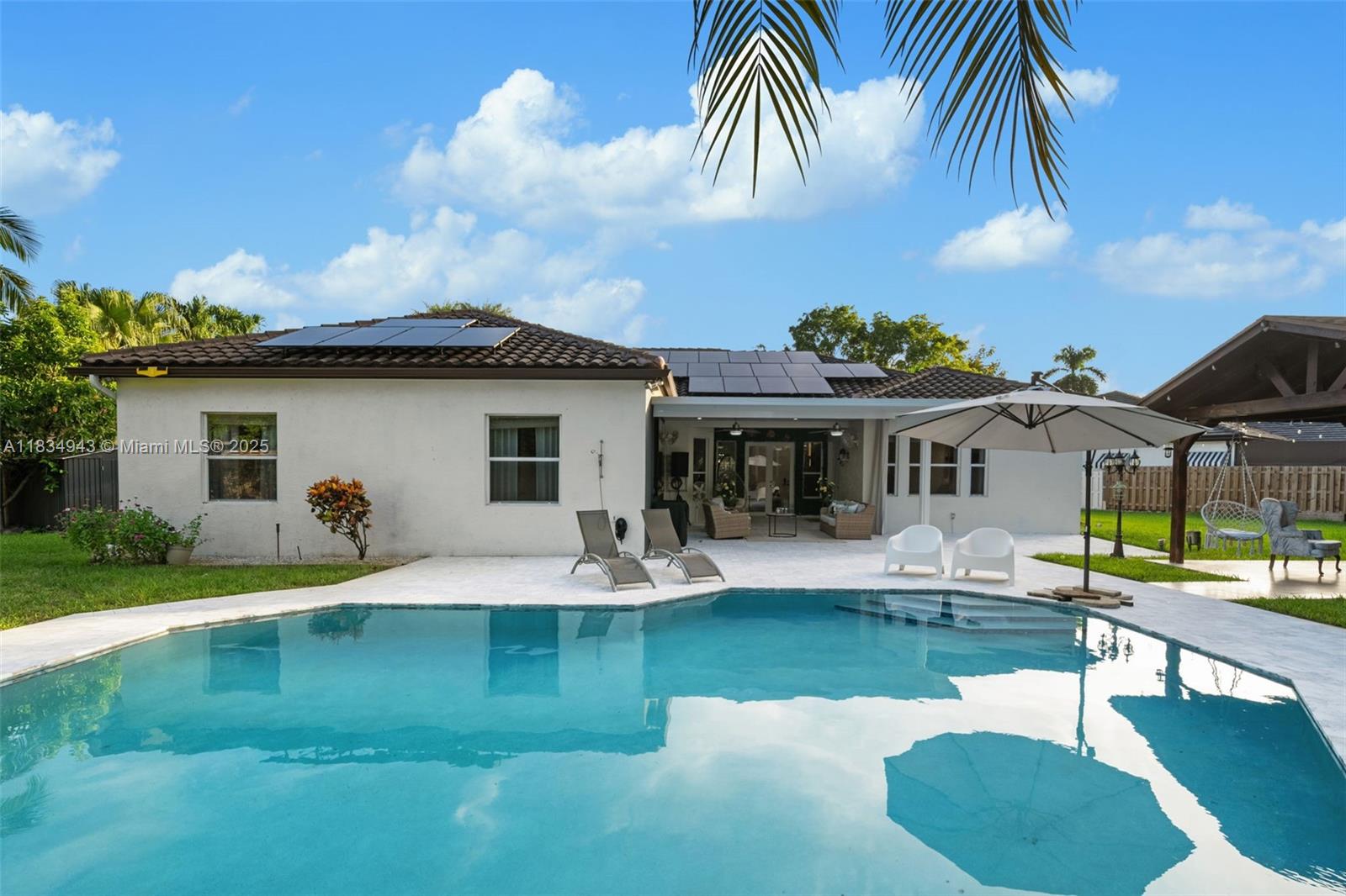 14501 Southwest 33rd Court Miramar, FL 33027 - Photo 45 of 91 a front view of house with yard and seating area