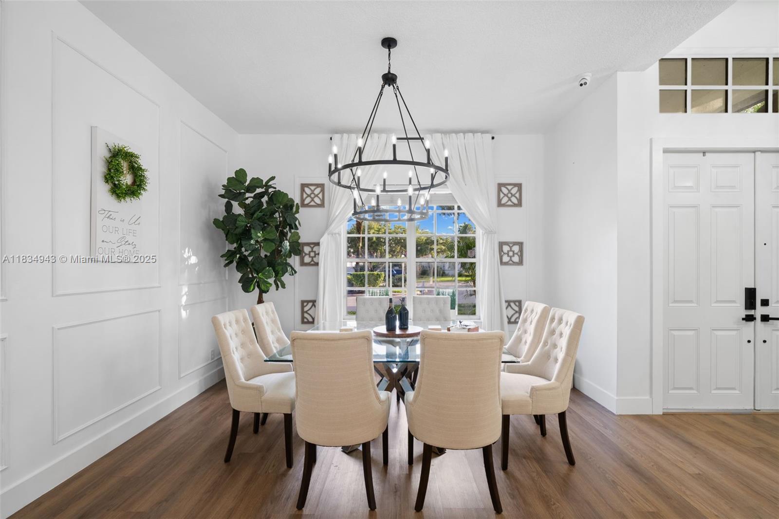 14501 Southwest 33rd Court Miramar, FL 33027 - Photo 5 of 91 a view of a dining room with furniture window and wooden floor