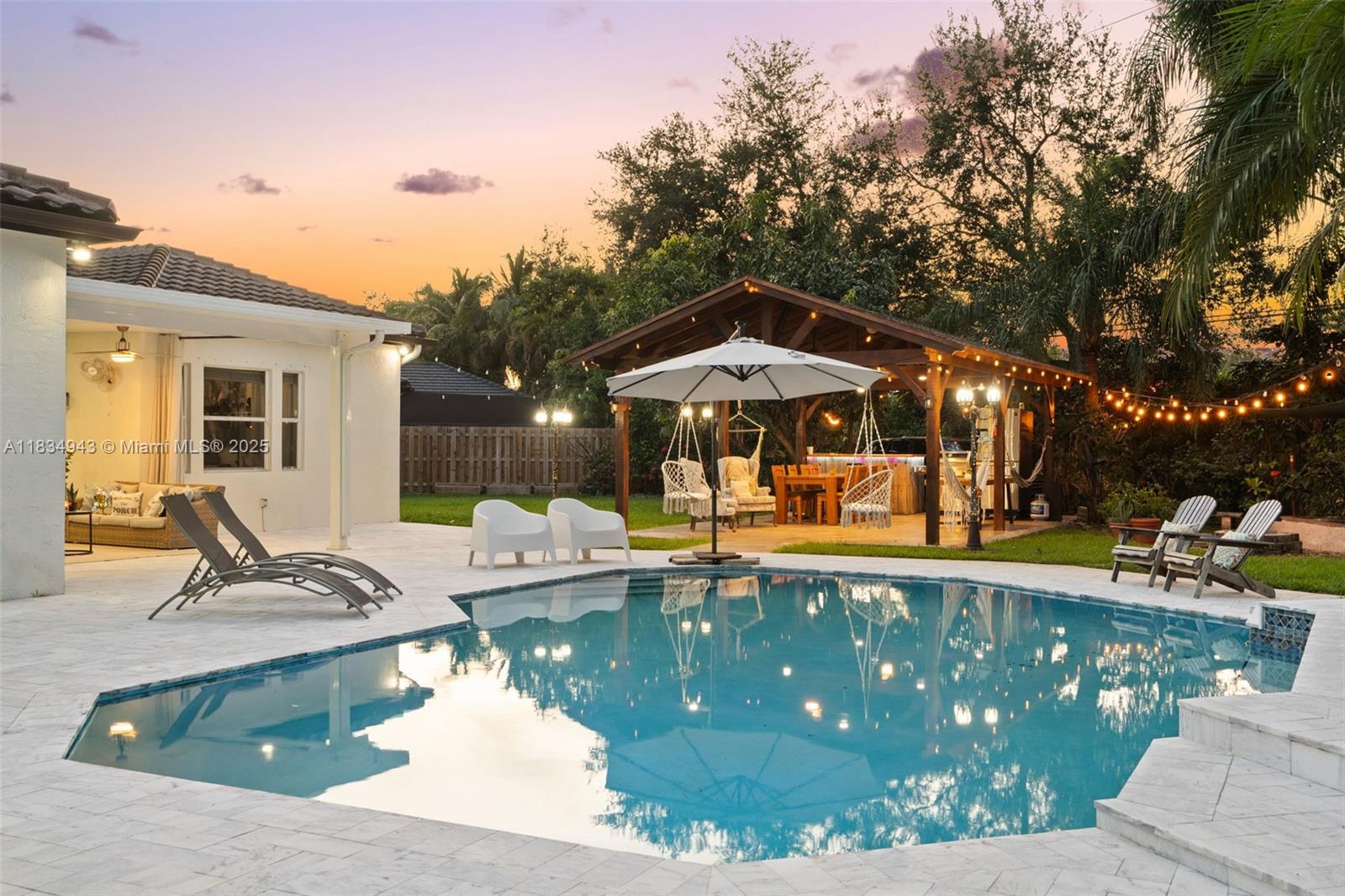14501 Southwest 33rd Court Miramar, FL 33027 - Photo 54 of 91 a view of a house with swimming pool and sitting area