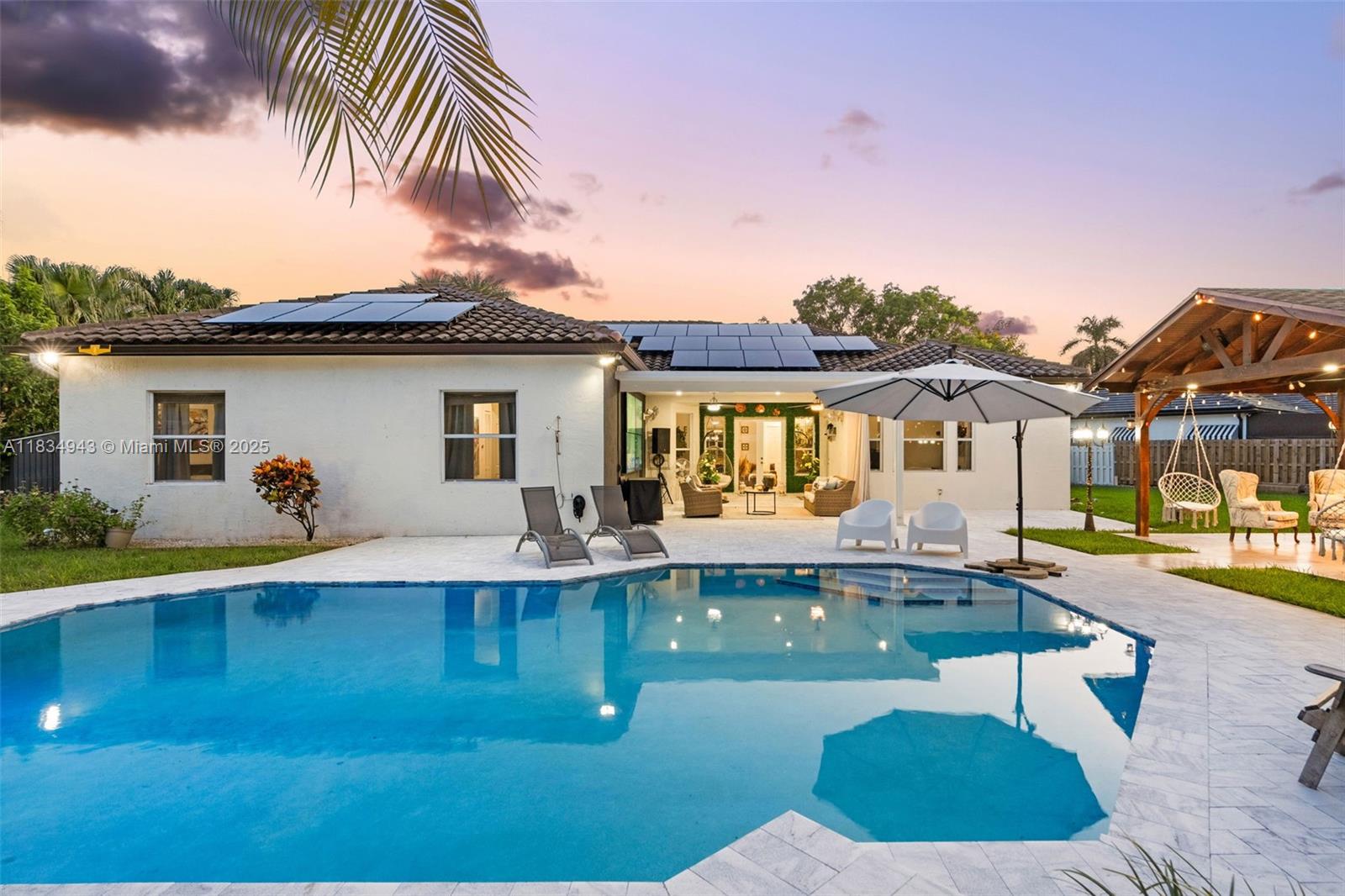 14501 Southwest 33rd Court Miramar, FL 33027 - Photo 57 of 91 a view of house with swimming pool yard and outdoor seating