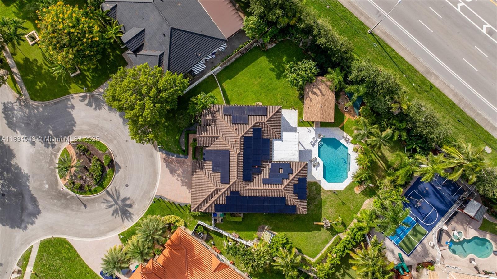 14501 Southwest 33rd Court Miramar, FL 33027 - Photo 67 of 91 an aerial view of a house with garden space and a car park