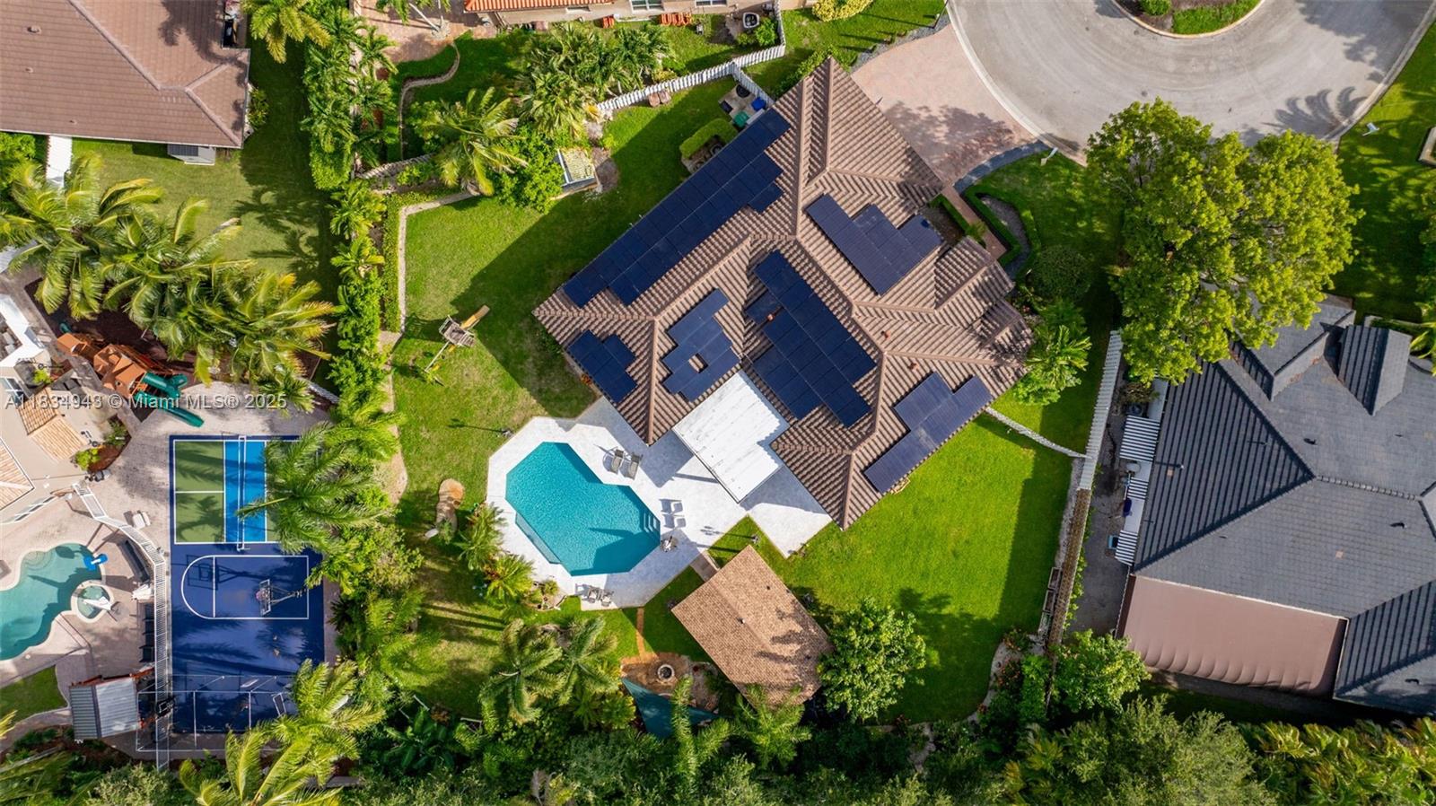 14501 Southwest 33rd Court Miramar, FL 33027 - Photo 72 of 91 an aerial view of a house with a garden and swimming pool