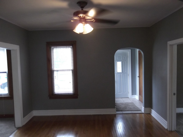 404 West Minnesota Street Spring Valley, IL 61362 - Photo 10 of 19 wooden floor in an empty room with a window