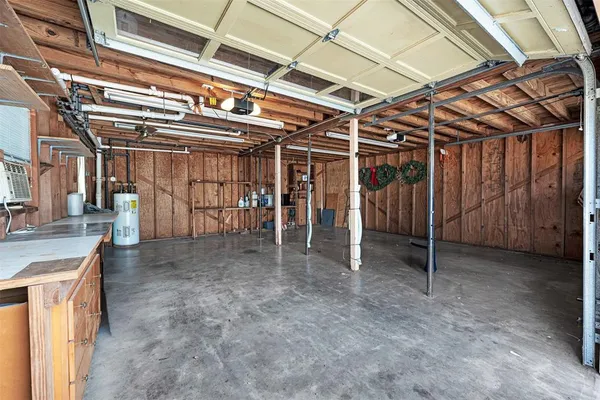 a view of an empty room with wooden walls