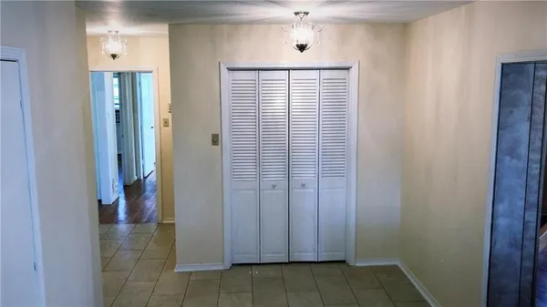 a view of a hallway with closet