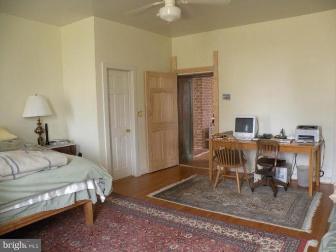 3771 Point Of Rocks Road Jefferson, MD 21755 - Photo 13 of 30 a bedroom with furniture and a table