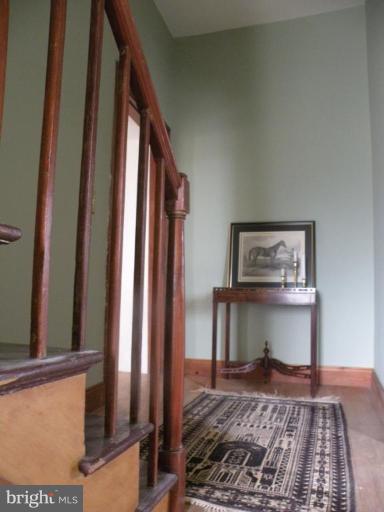 3771 Point Of Rocks Road Jefferson, MD 21755 - Photo 15 of 30 a view of a hallway with wooden floor and furniture