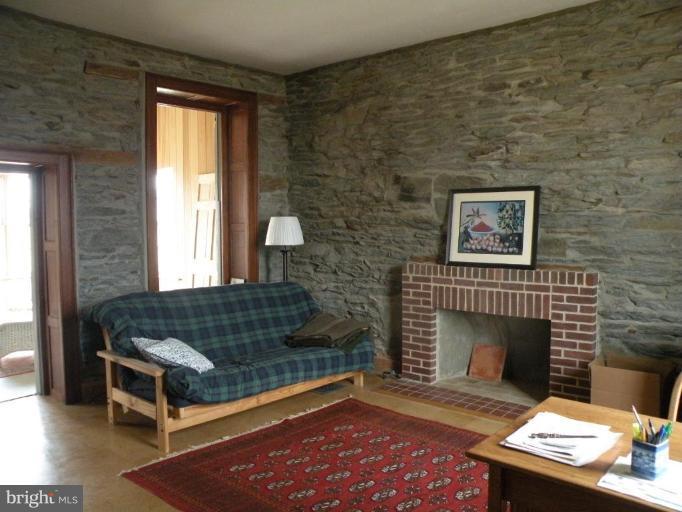 3771 Point Of Rocks Road Jefferson, MD 21755 - Photo 17 of 30 a living room with furniture a rug and a fireplace