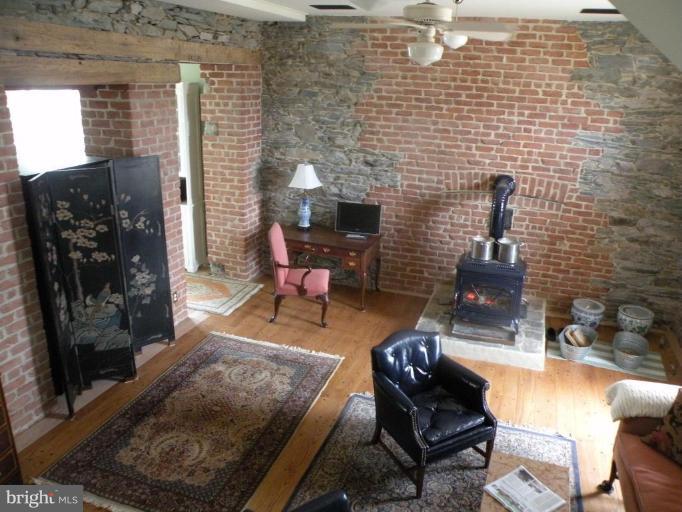 3771 Point Of Rocks Road Jefferson, MD 21755 - Photo 3 of 30 a living room with furniture and a fireplace
