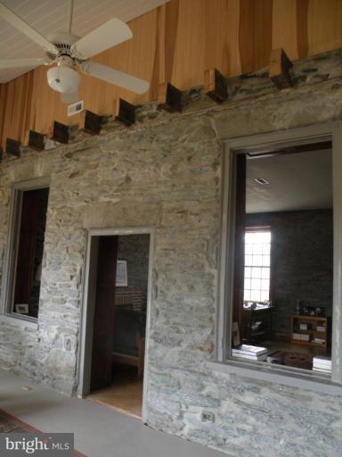 3771 Point Of Rocks Road Jefferson, MD 21755 - Photo 21 of 30 a hall with a sink and a mirror