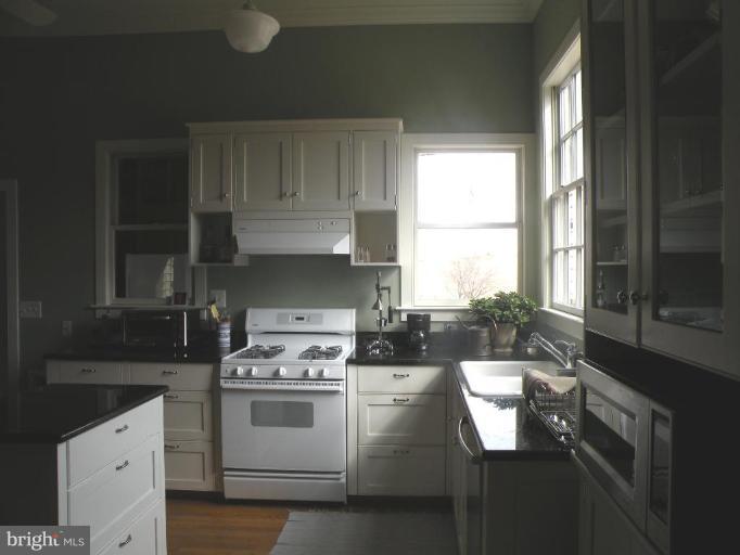 3771 Point Of Rocks Road Jefferson, MD 21755 - Photo 10 of 30 a kitchen with a stove a sink and a window
