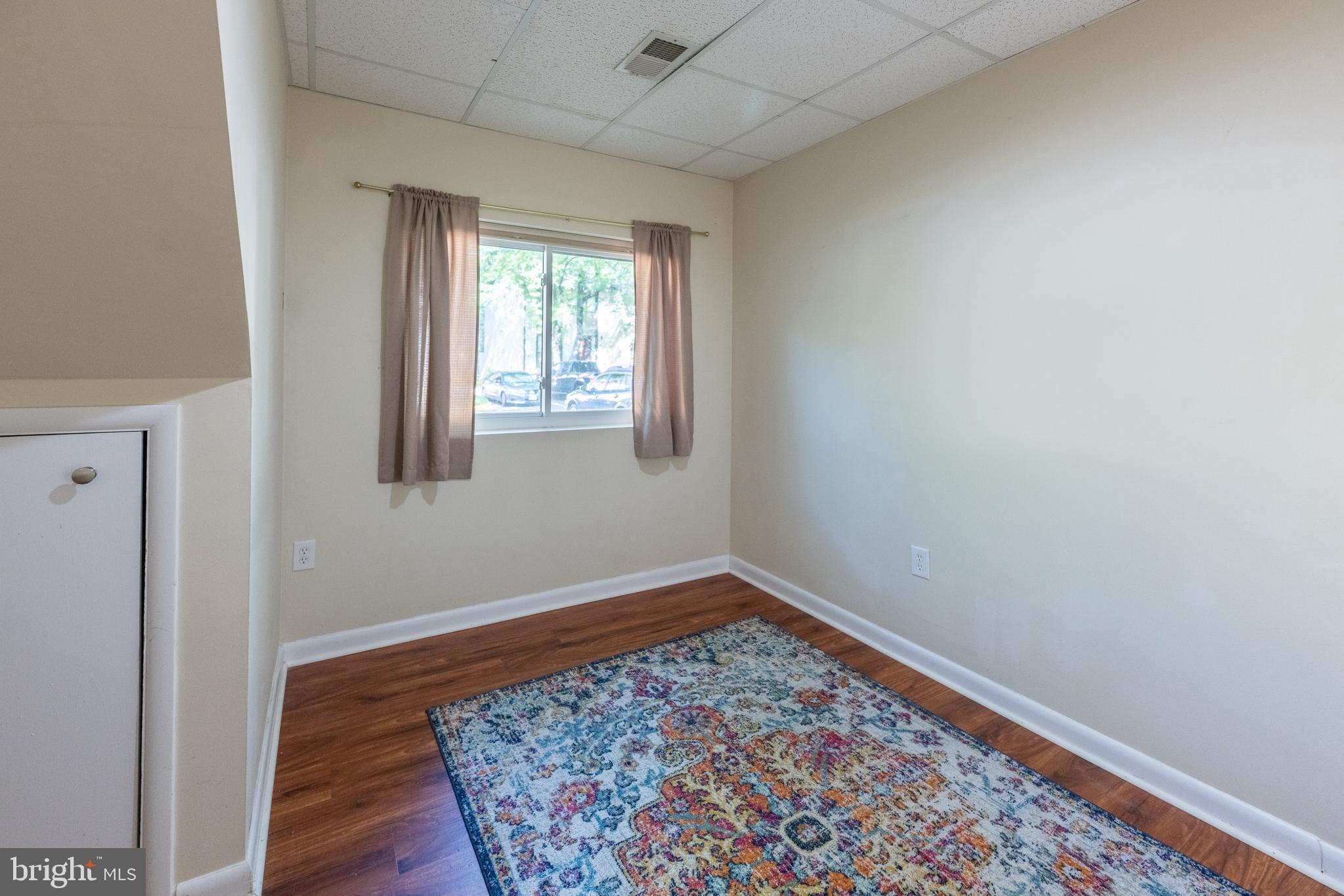 11917 Barrel Cooper Court Reston, VA 20191 - Photo 42 of 59 an empty room with wooden floor and windows