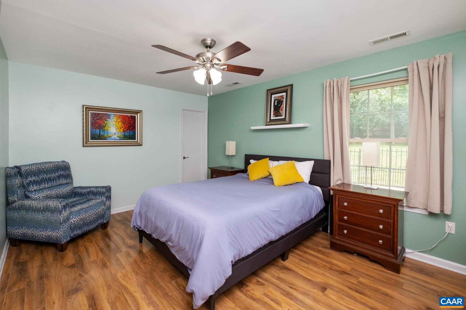 17 Jonquil Road Ruckersville, VA 22968 - Photo 16 of 33 a bedroom with a bed and a couch