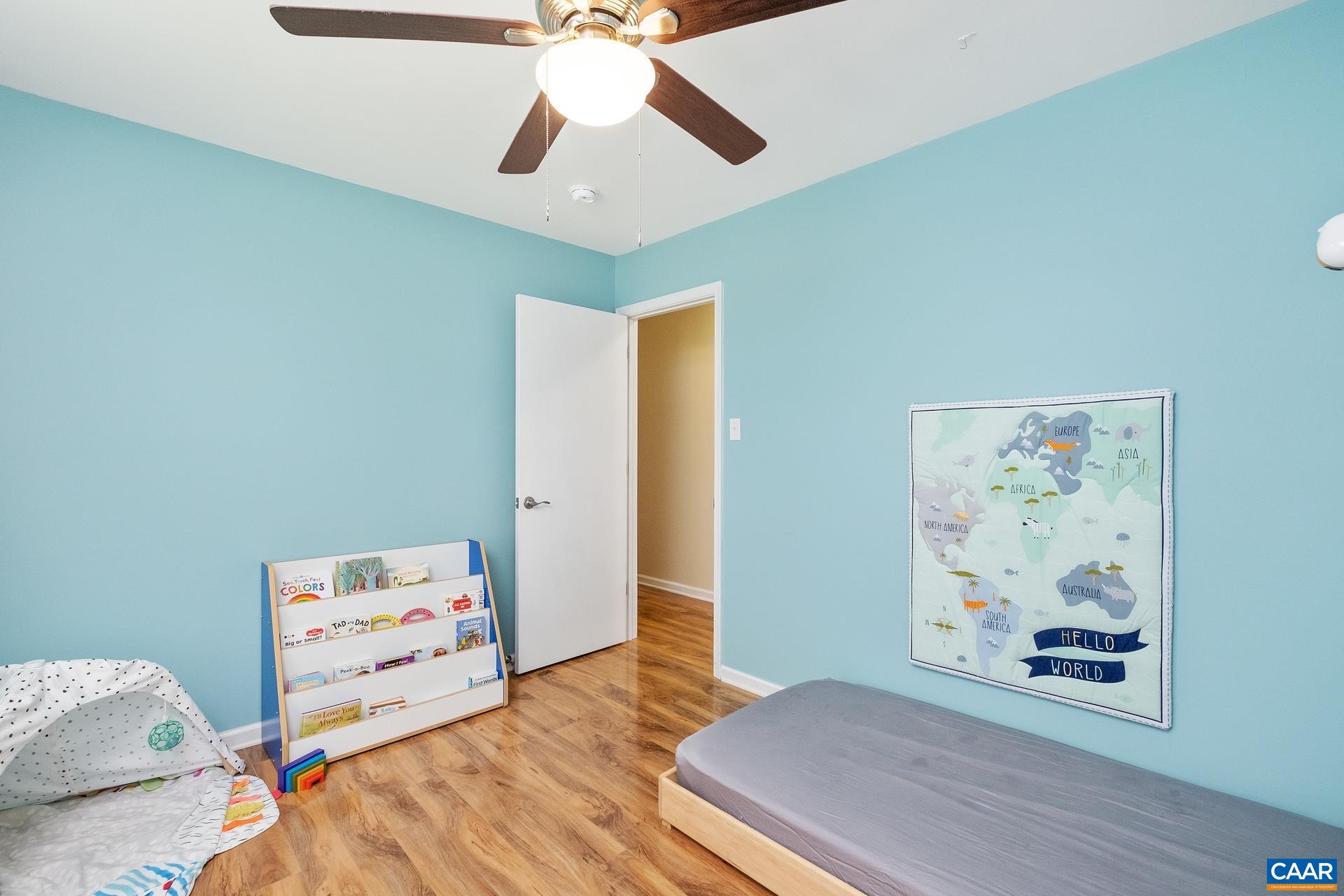 17 Jonquil Road Ruckersville, VA 22968 - Photo 21 of 33 a bedroom with a bed and a chandelier