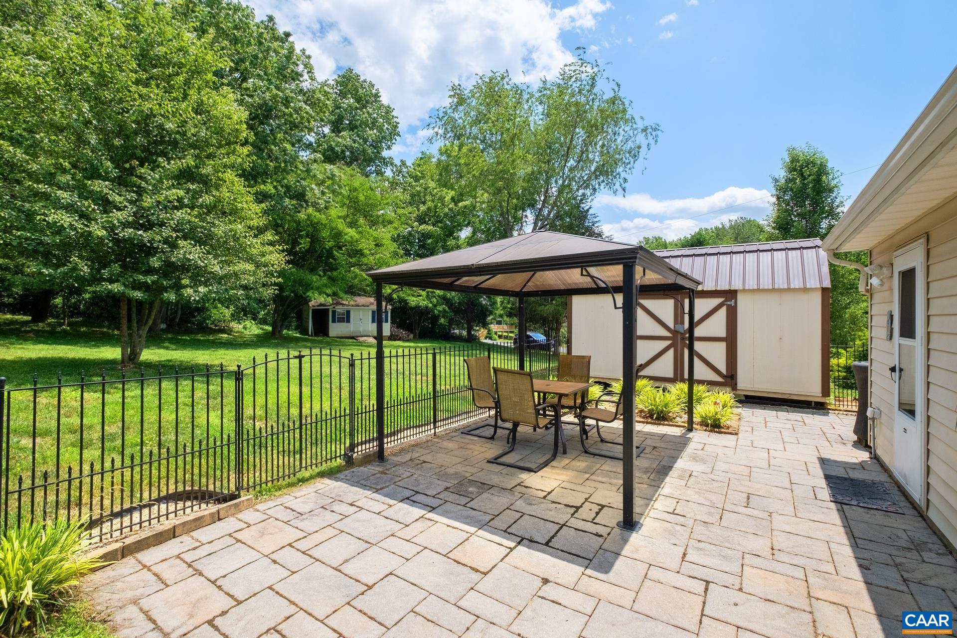 17 Jonquil Road Ruckersville, VA 22968 - Photo 26 of 33 a view of a deck with a table and chairs