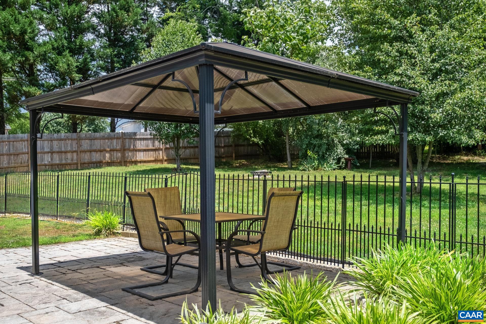 17 Jonquil Road Ruckersville, VA 22968 - Photo 27 of 33 a view of a chair and table in the garden