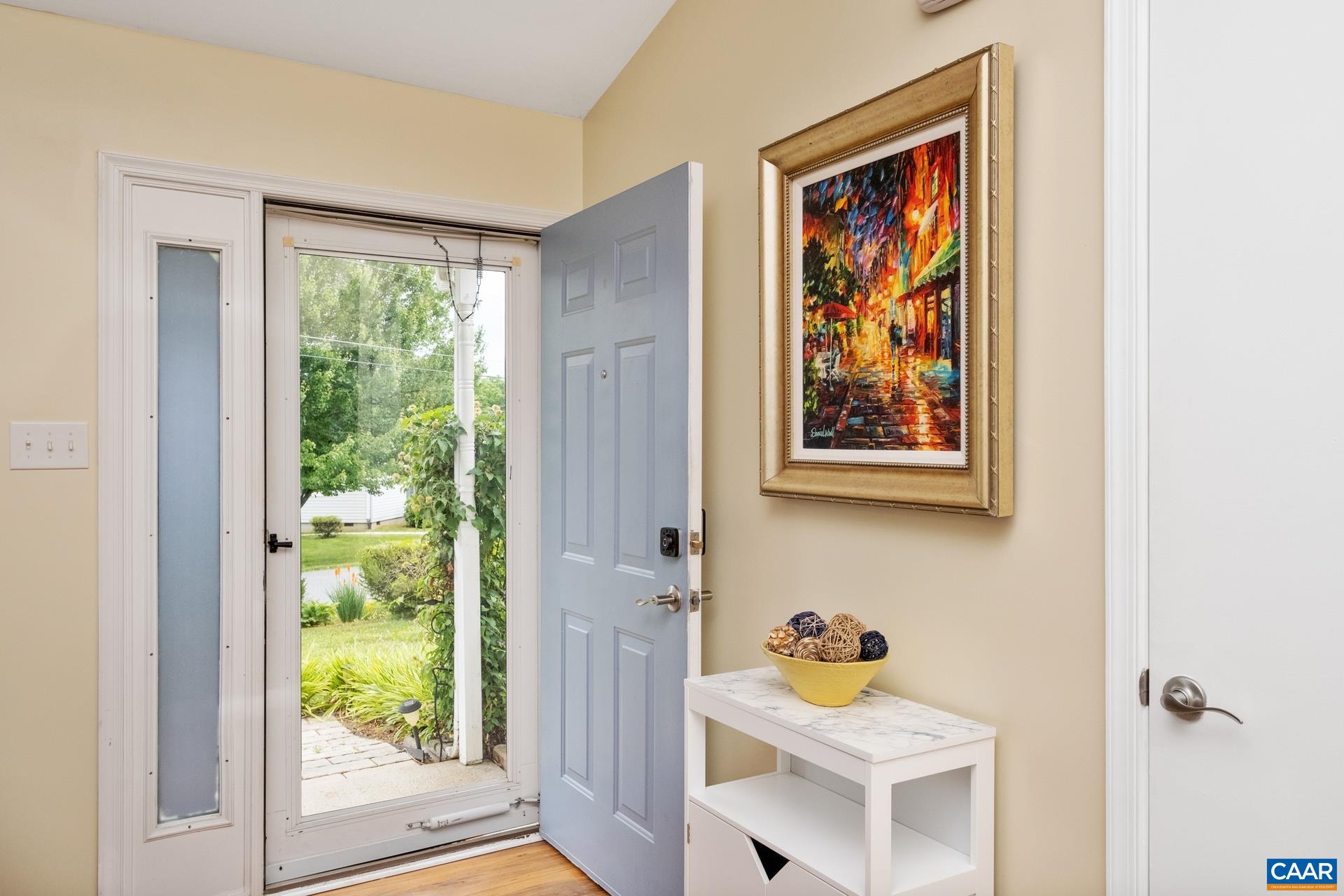 17 Jonquil Road Ruckersville, VA 22968 - Photo 6 of 33 a view of a hallway that has a painting on the wall and a window