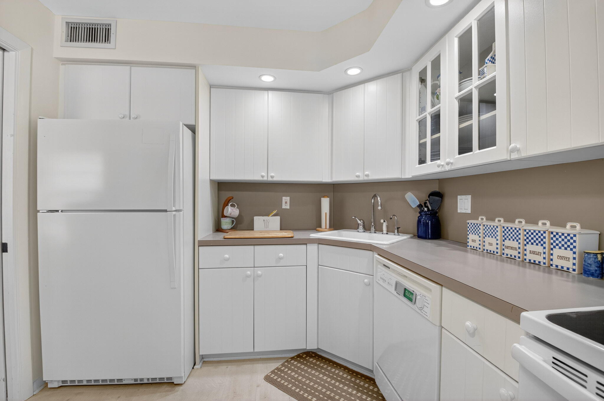 1 Harbourside Drive, Unit 4205 Delray Beach, FL 33483 - Photo 20 of 97 a kitchen with a sink and refrigerator