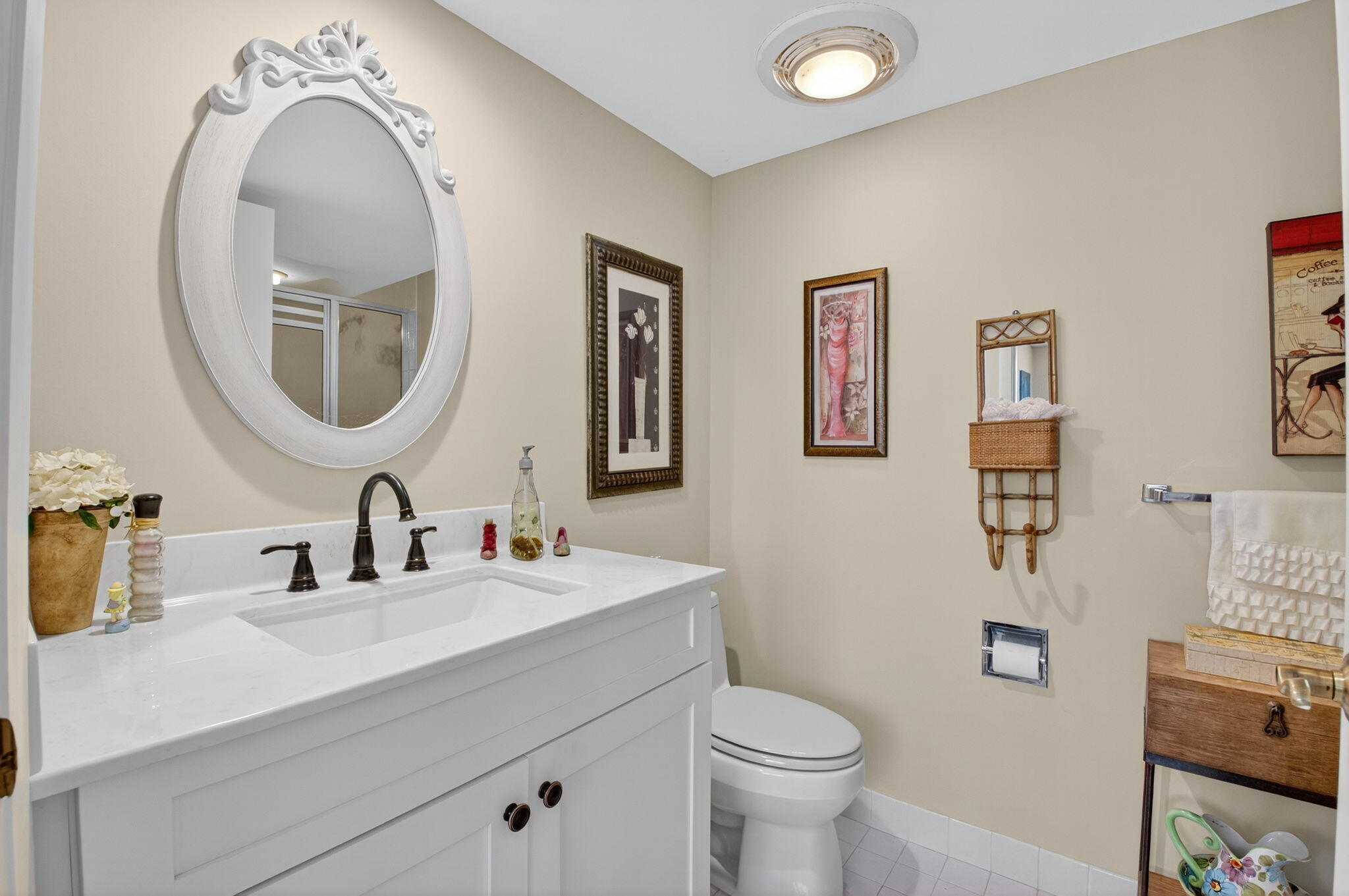 1 Harbourside Drive, Unit 4205 Delray Beach, FL 33483 - Photo 25 of 97 a bathroom with a toilet sink and mirror