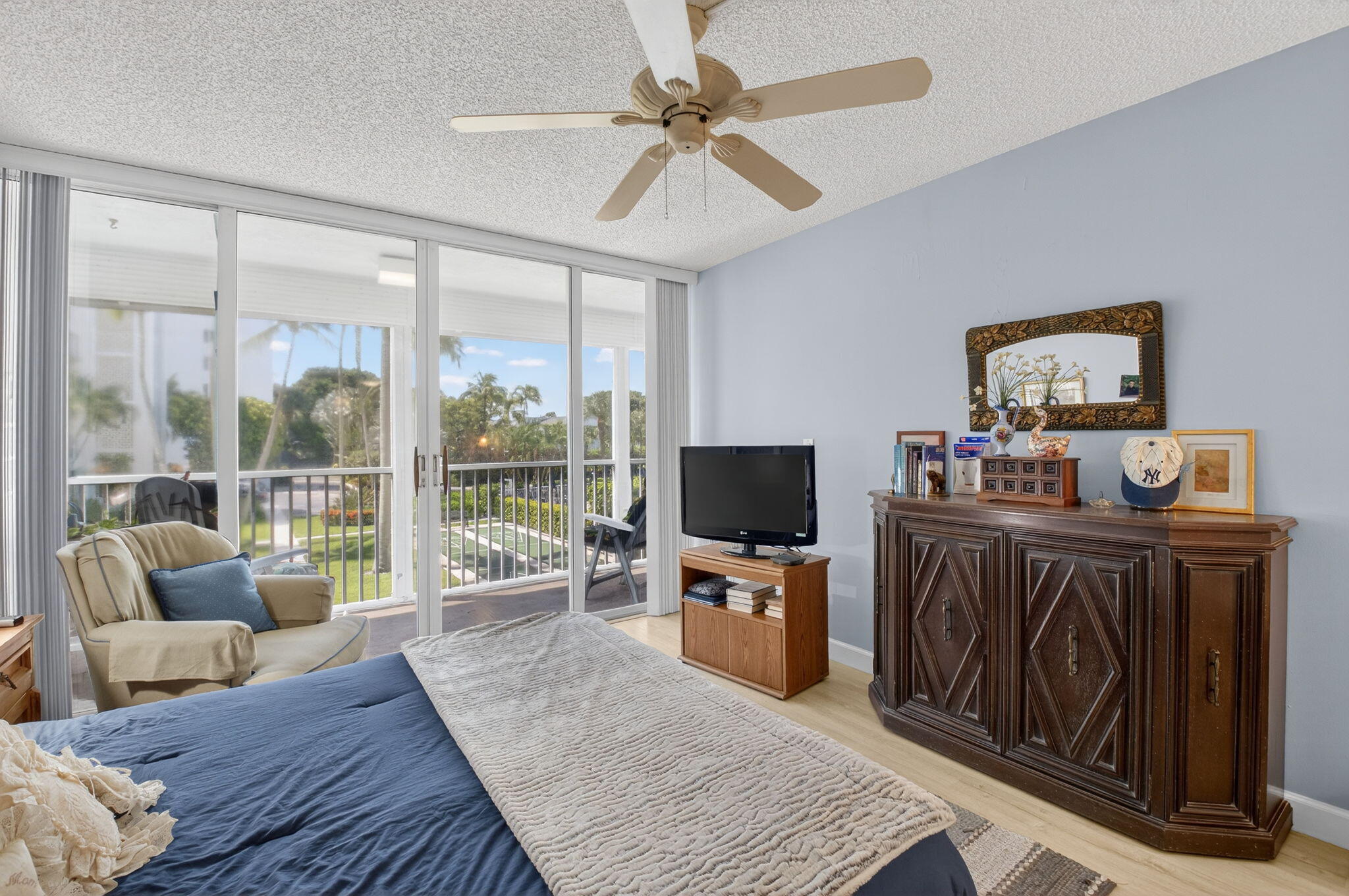 1 Harbourside Drive, Unit 4205 Delray Beach, FL 33483 - Photo 28 of 97 a living room with furniture a flat screen tv and a floor to ceiling window