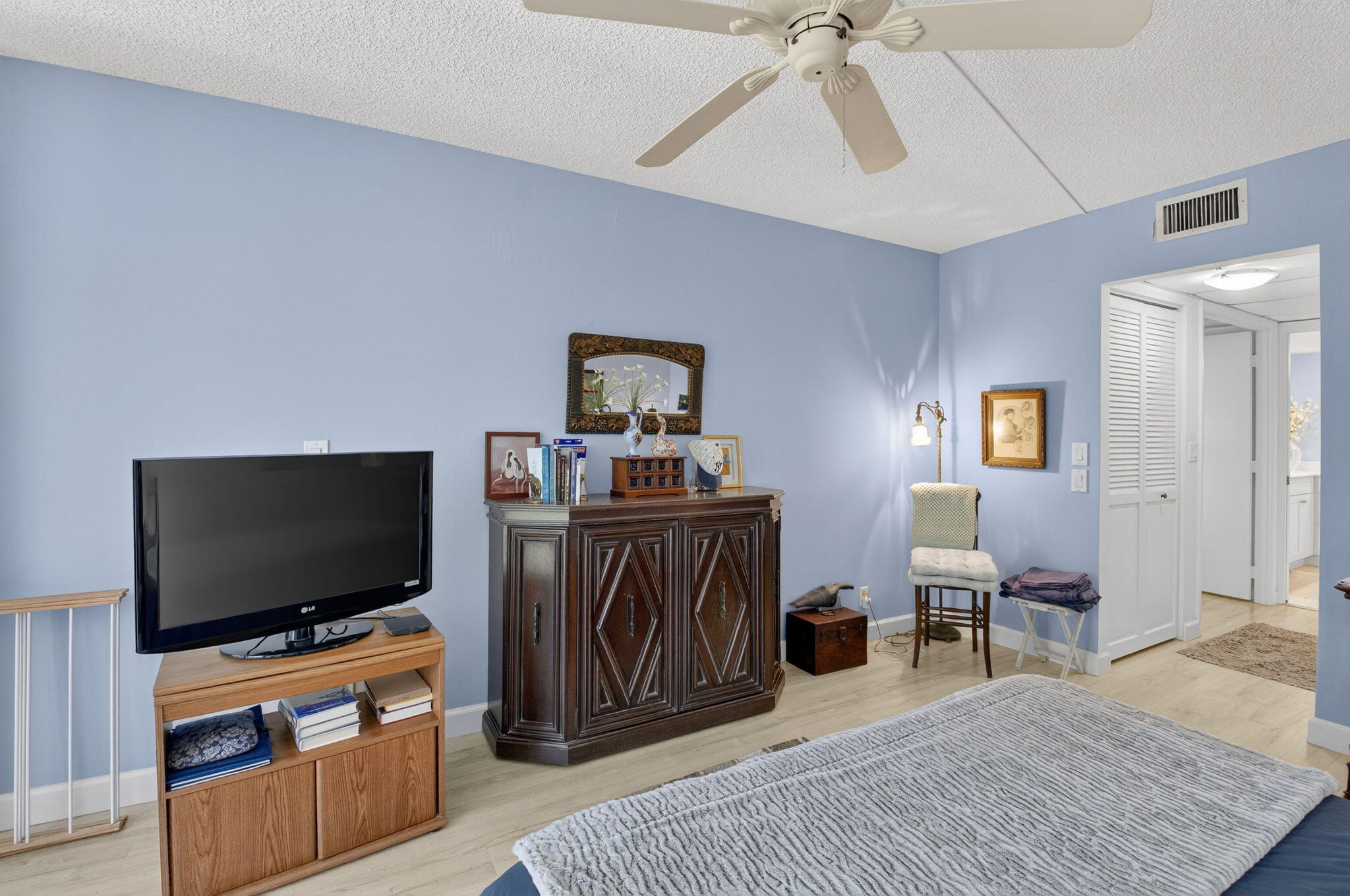 1 Harbourside Drive, Unit 4205 Delray Beach, FL 33483 - Photo 30 of 97 a bedroom with furniture and a flat screen tv