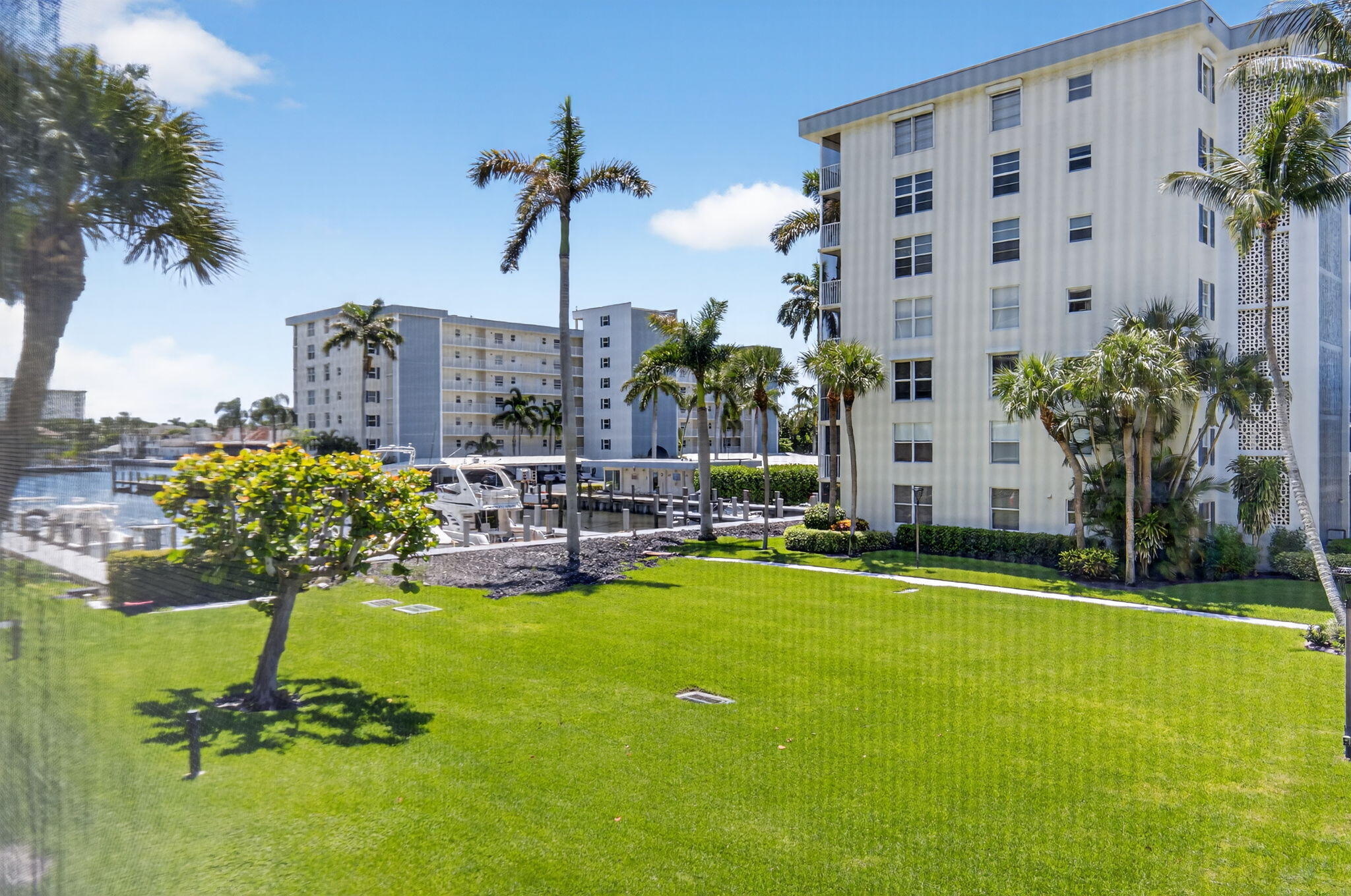 1 Harbourside Drive, Unit 4205 Delray Beach, FL 33483 - Photo 34 of 97 a view of a swimming pool with a yard