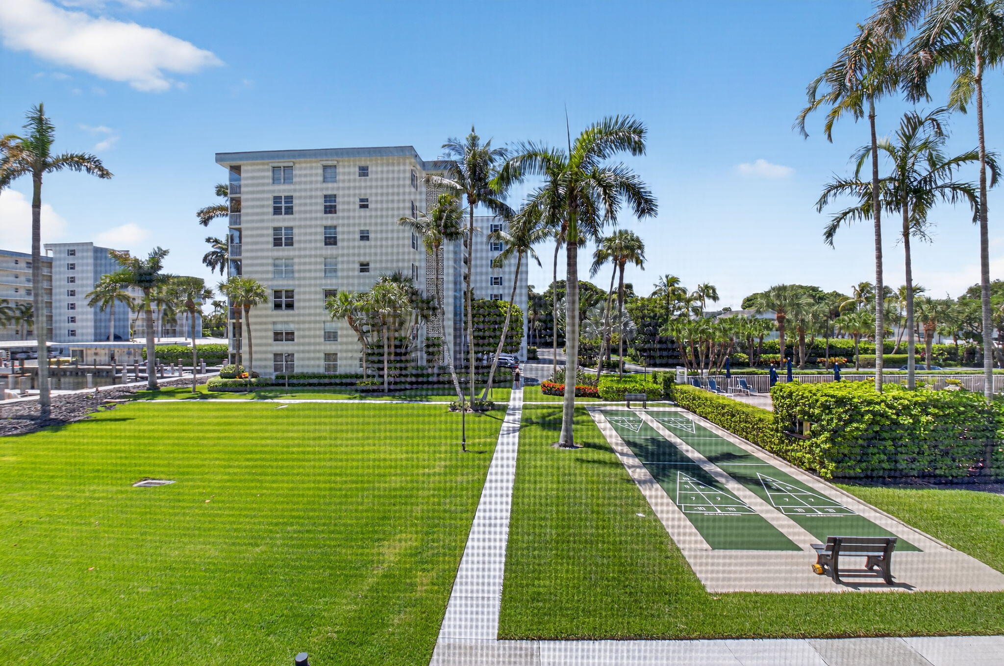 1 Harbourside Drive, Unit 4205 Delray Beach, FL 33483 - Photo 39 of 97 a swimming pool with outdoor seating and garden