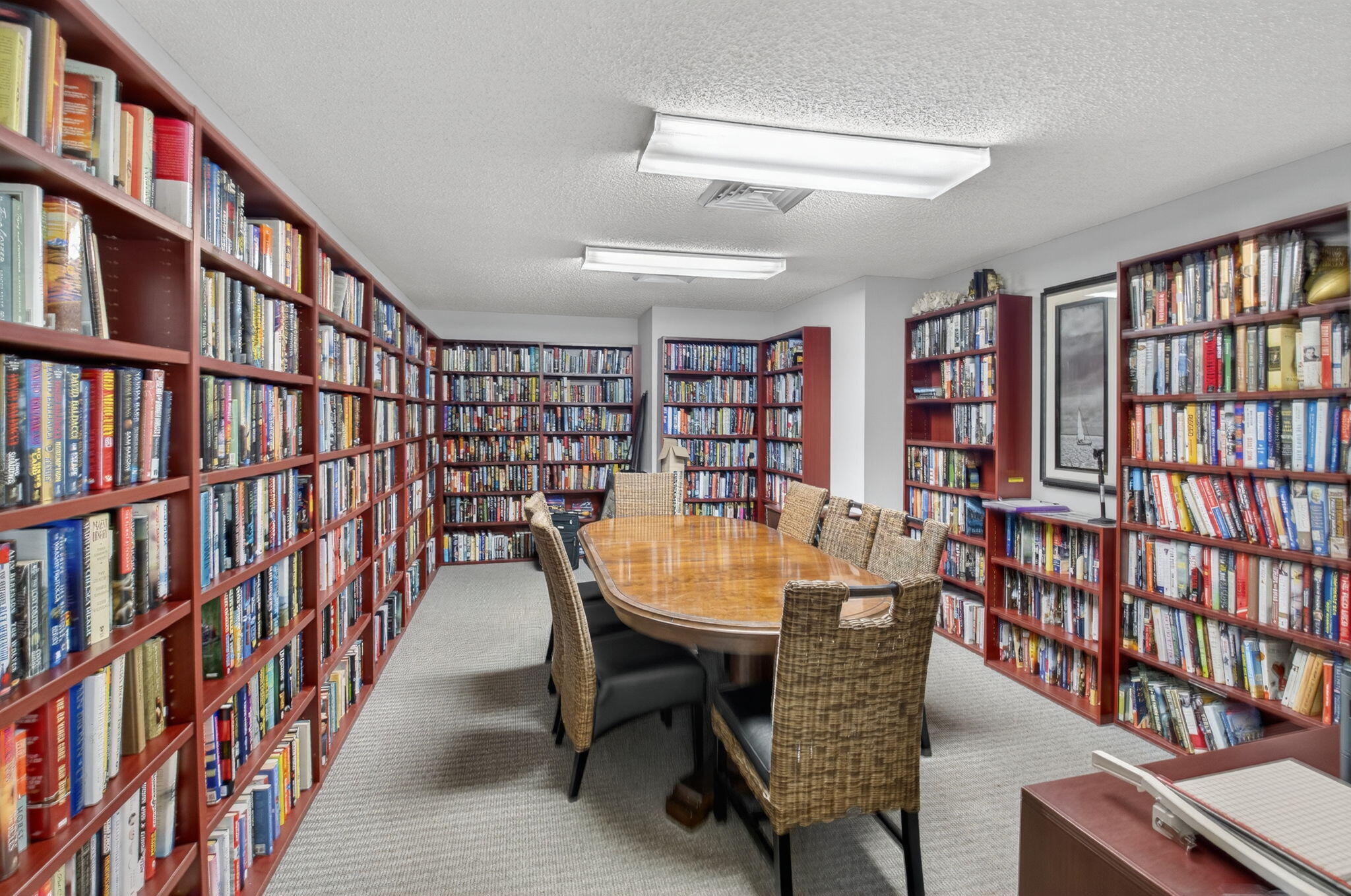 1 Harbourside Drive, Unit 4205 Delray Beach, FL 33483 - Photo 49 of 97 a dining room with furniture and a book shelf