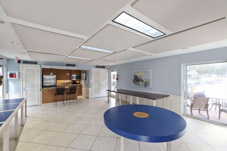 1 Harbourside Drive, Unit 4205 Delray Beach, FL 33483 - Photo 74 of 97 a living room with furniture and a flat screen tv