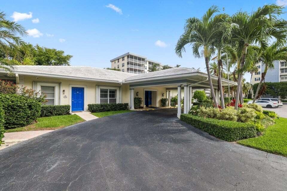 1 Harbourside Drive, Unit 4205 Delray Beach, FL 33483 - Photo 77 of 97 a view of a white house with a big yard and potted plants