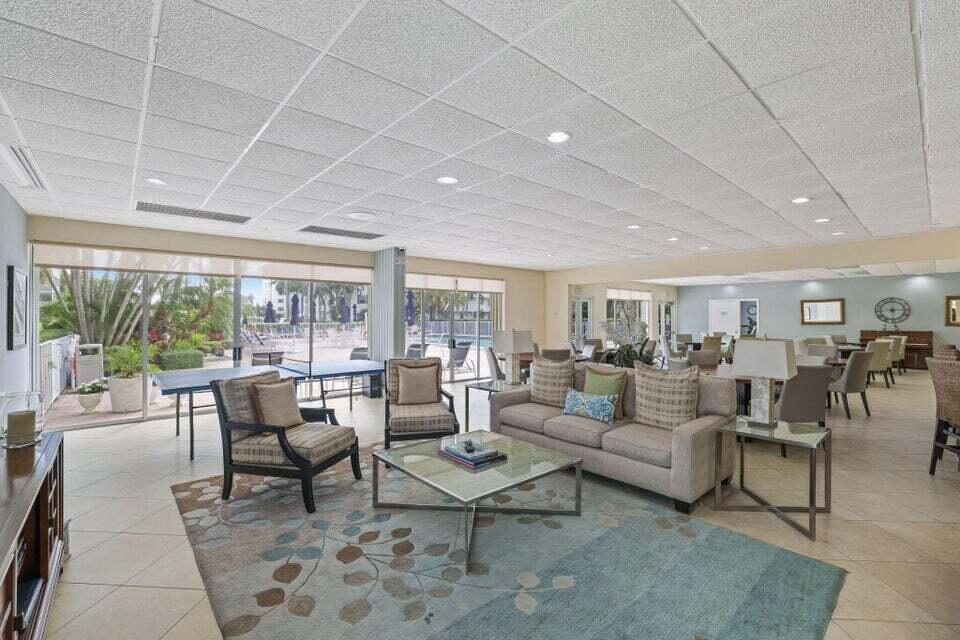 1 Harbourside Drive, Unit 4205 Delray Beach, FL 33483 - Photo 78 of 97 a living room with furniture and a table