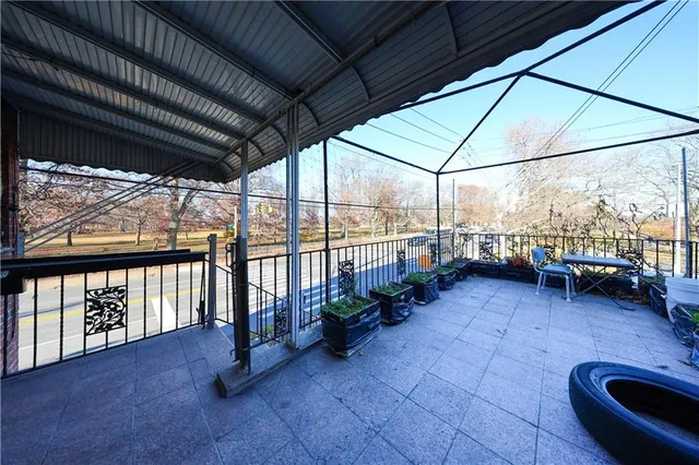a view of a porch with furniture and a patio