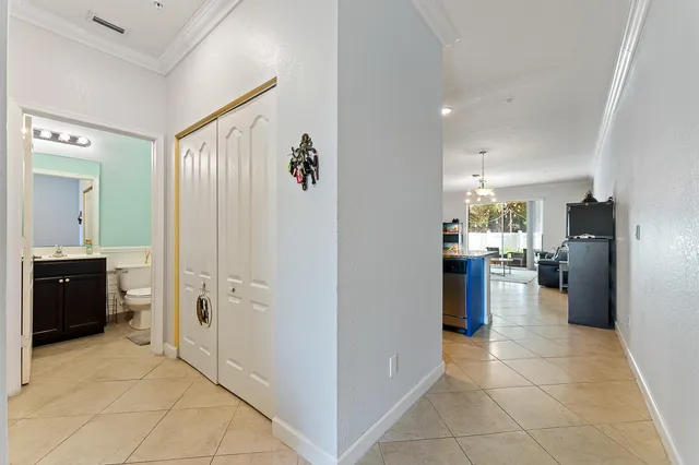 a view of a kitchen with refrigerator and furniture