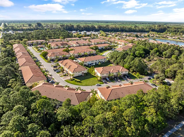 an aerial view of residential houses with outdoor space