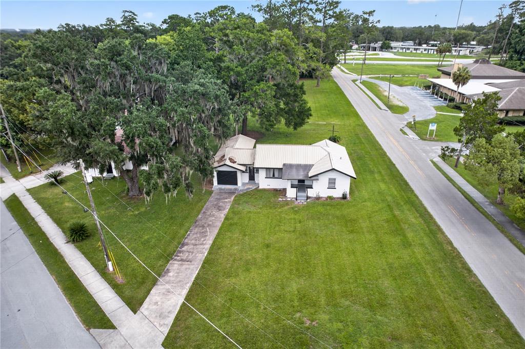 5514 Southeast Hames Road Belleview, FL 34420 - Photo 35 of 44 a view of a house with a yard