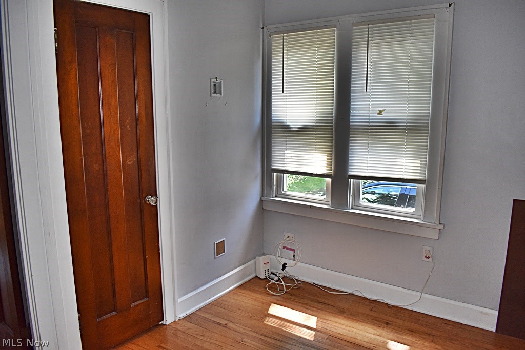 7715 Ackley Road Parma, OH 44129 - Photo 12 of 27 First floor bedroom with light wood-type flooring