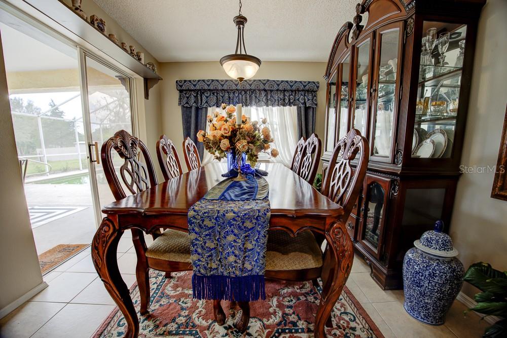 567 Silver Course Run Ocala, FL 34472 - Photo 11 of 95 a view of a dining room with furniture and window