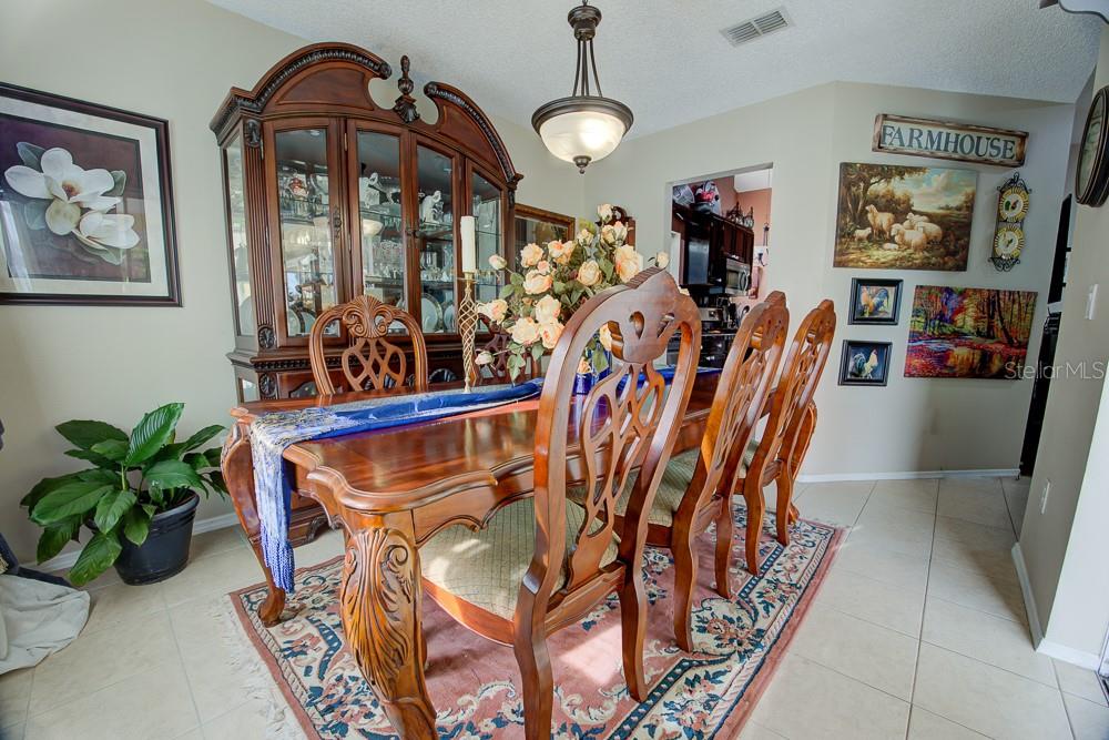 567 Silver Course Run Ocala, FL 34472 - Photo 13 of 95 a view of a dining room with furniture and chandelier