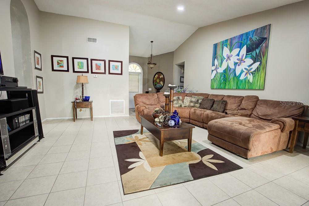 567 Silver Course Run Ocala, FL 34472 - Photo 14 of 95 a living room with furniture and a fireplace