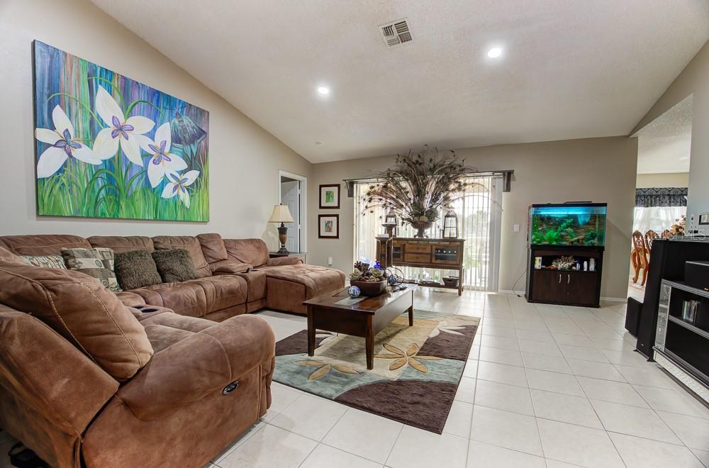 567 Silver Course Run Ocala, FL 34472 - Photo 16 of 95 a living room with furniture and a fireplace