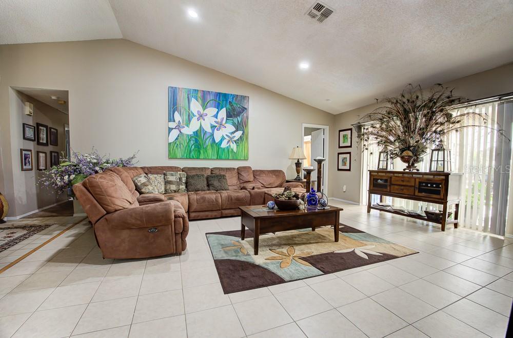 567 Silver Course Run Ocala, FL 34472 - Photo 18 of 95 a living room with furniture and a couch