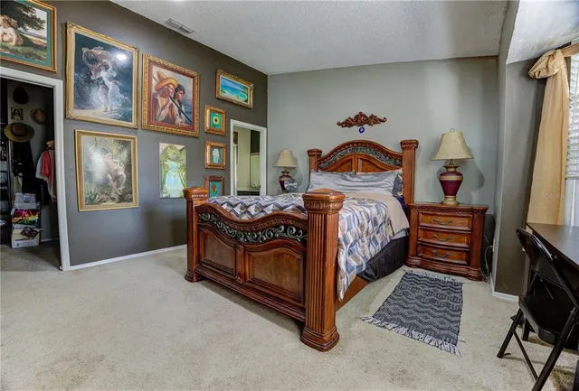 a view of a house with a backyard porch and sitting area