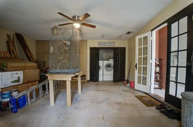 a view of house with outdoor space and parking