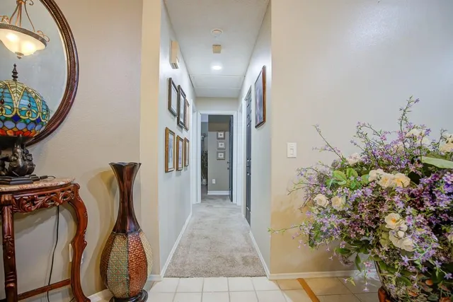 a view of a dining room with furniture and a window