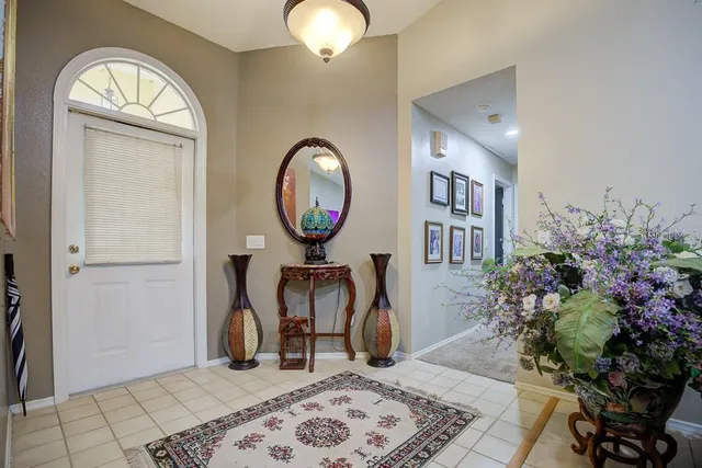 a view of a dining room with furniture and window
