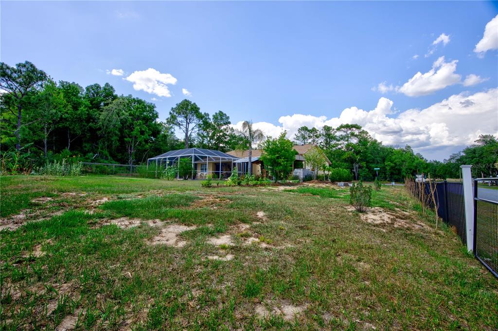 567 Silver Course Run Ocala, FL 34472 - Photo 55 of 95 a view of a house with a backyard
