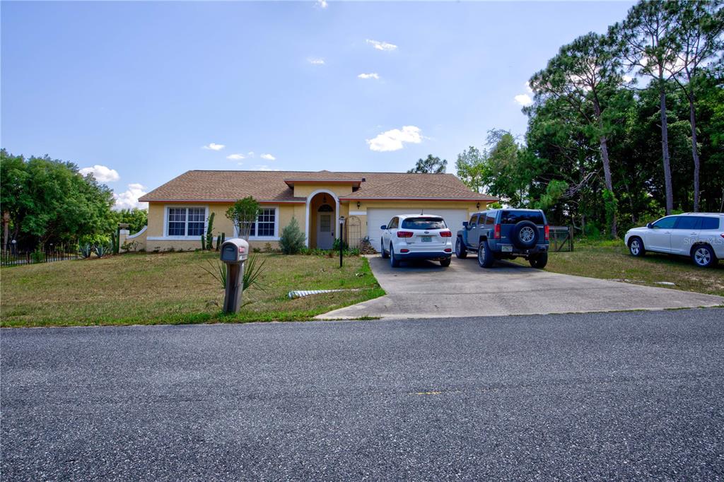 567 Silver Course Run Ocala, FL 34472 - Photo 66 of 95 a view of house with outdoor space and parking