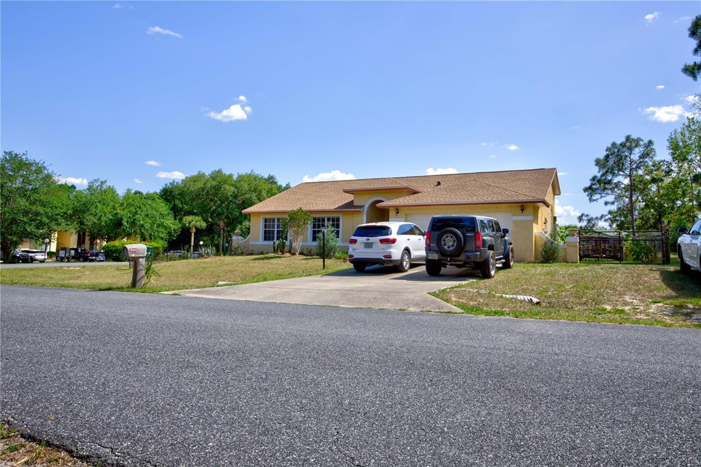 567 Silver Course Run Ocala, FL 34472 - Photo 67 of 95 a view of a house with a yard and sitting area
