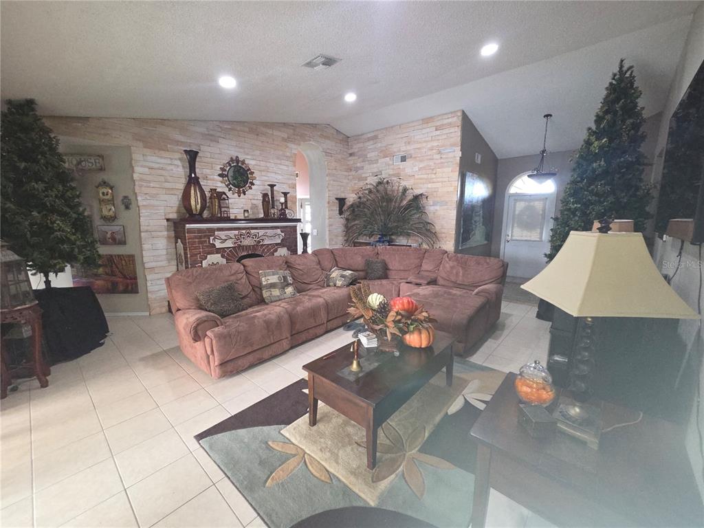 567 Silver Course Run Ocala, FL 34472 - Photo 85 of 95 a living room with furniture and a painting