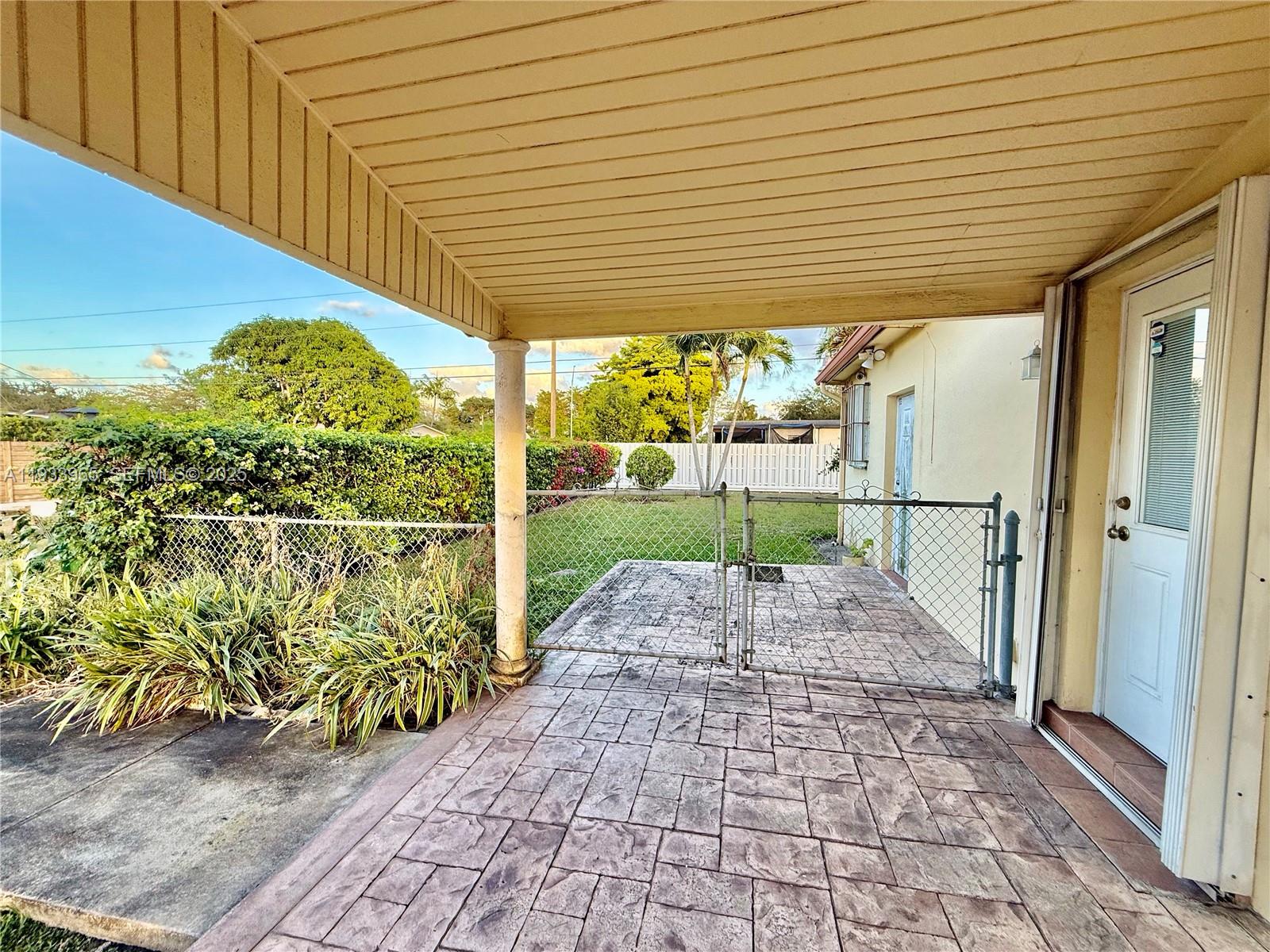 2801 Southwest 92nd Court Miami, FL 33165 - Photo 6 of 32 Carport with Gate to Backyard